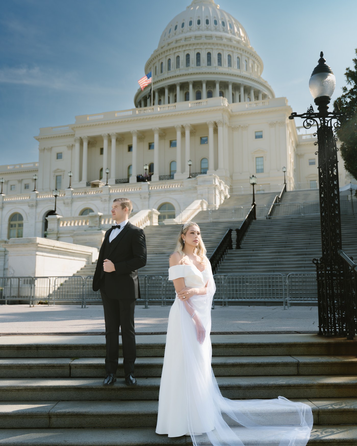 Luxury wedding couple on U.S. Capitol stairs Washington DC bride veil train Kevin Socola Films