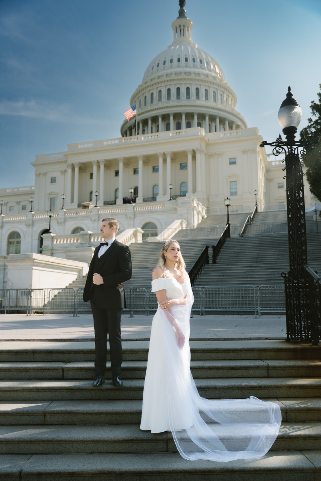 Bride and groom on the steps of the U.S. Capitol in Washington, DC by Kevin Socola Films
